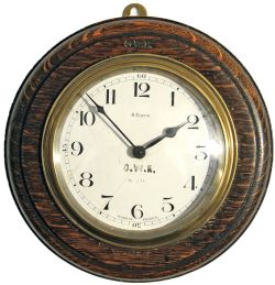 GWR 5½" diameter Pork Pie Clock. Oak cased stamped `GWR` on front of case. Complete with French