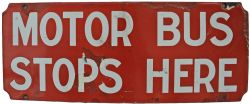 Enamel Bus Sign "Motor Bus Stops Here". White on Red with some restoration. Measuring 15" x 6".