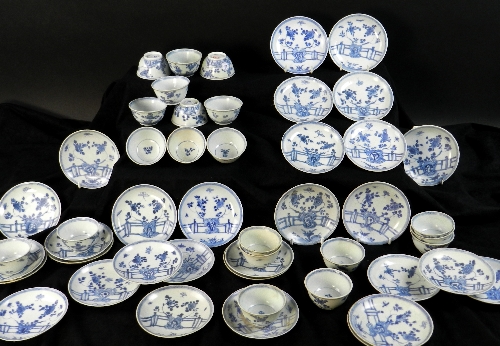 Ca Mau:Thirty rocks on a terrace pattern tea bowls and saucers, circa 1725, painted in blue with a