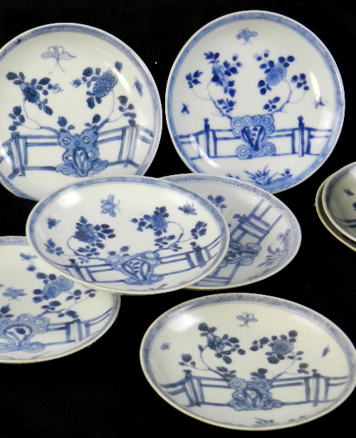 Ca Mau: Thirty rocks on a terrace pattern saucers, circa 1725, painted in blue with a peony and