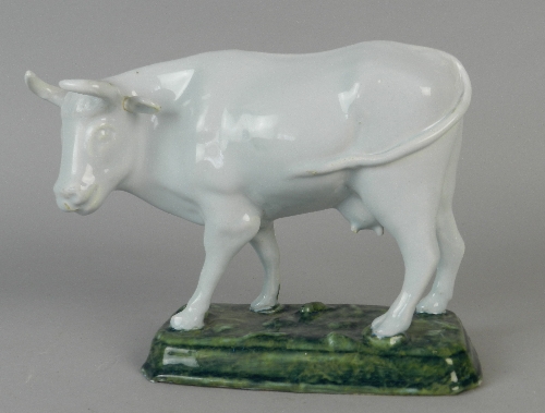 A good Dutch Delft figure of a cow, 18th century, well modelled standing foursquare with head