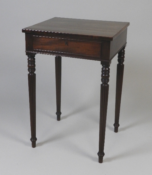A William IV mahogany single drawer side table on four slender tapering reeded legs, 51.5cm wide,