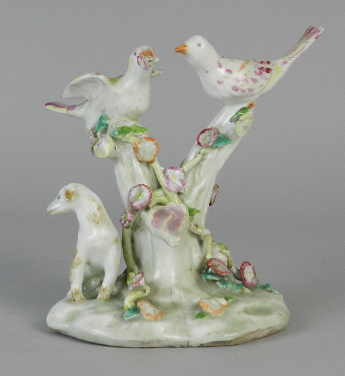 A rare early Bow porcelain group of two birds and a 'dismal' hound, circa 1754, the birds perched