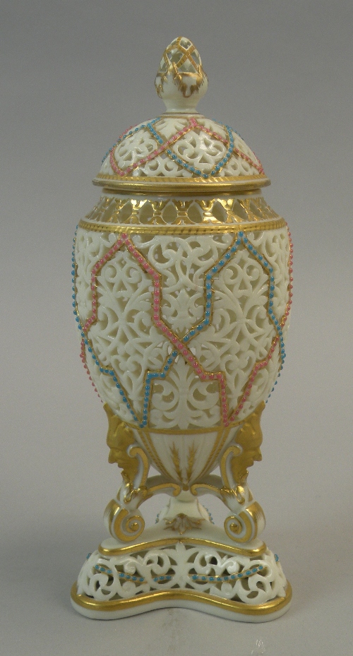 A Grainger and Co, Worcester reticulated vase and cover, circa 1880, the ovoid body raised upon