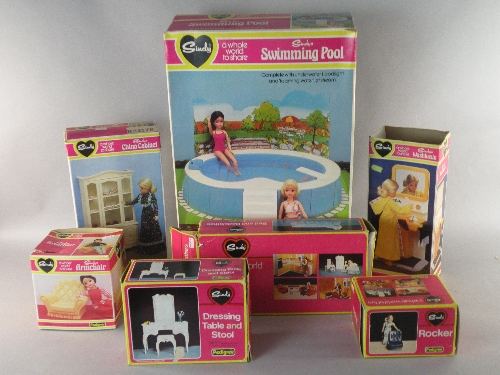 A group of eleven boxed Sindy accessories to include a wash basin, a rocker chair, a bed and bed