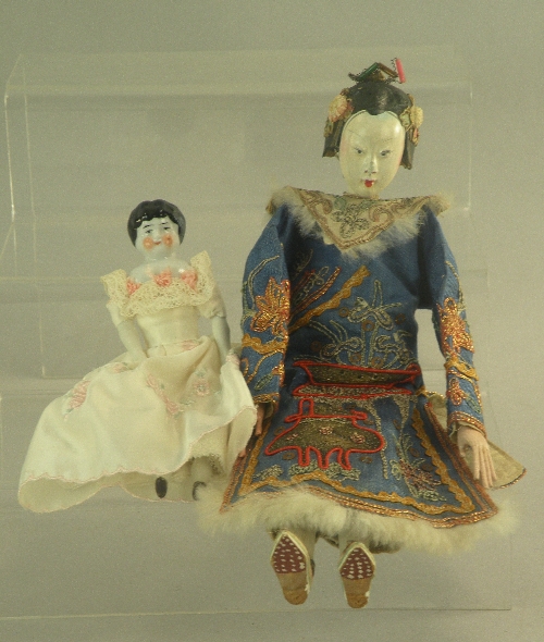 A composition Geisha doll, circa 1900, the doll dressed in traditional costume with hand