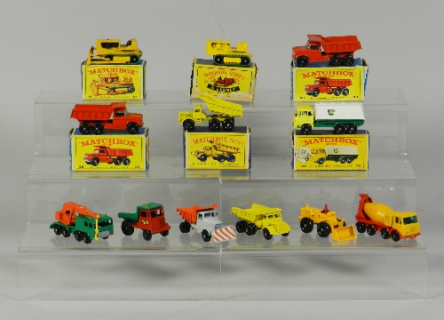 A group of twelve Matchbox miniatures, boxed models include a No.48 Dump Truck, a No.8 Caterpillar
