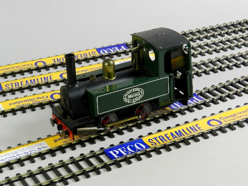 An unboxed Mamod steam locomotive (catalogue reference SL1), a box of twelve 1M lengths of Peco