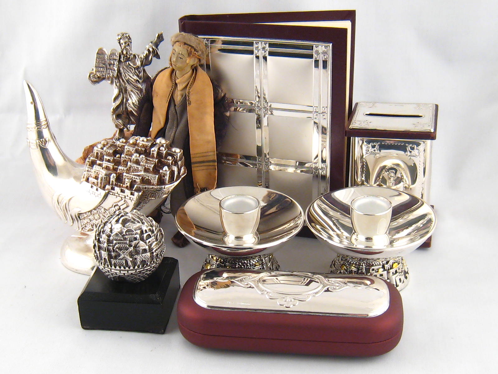 Judaica. Seven items, all silver cased or plated, also a figure of a boy, the body stuffed fabric