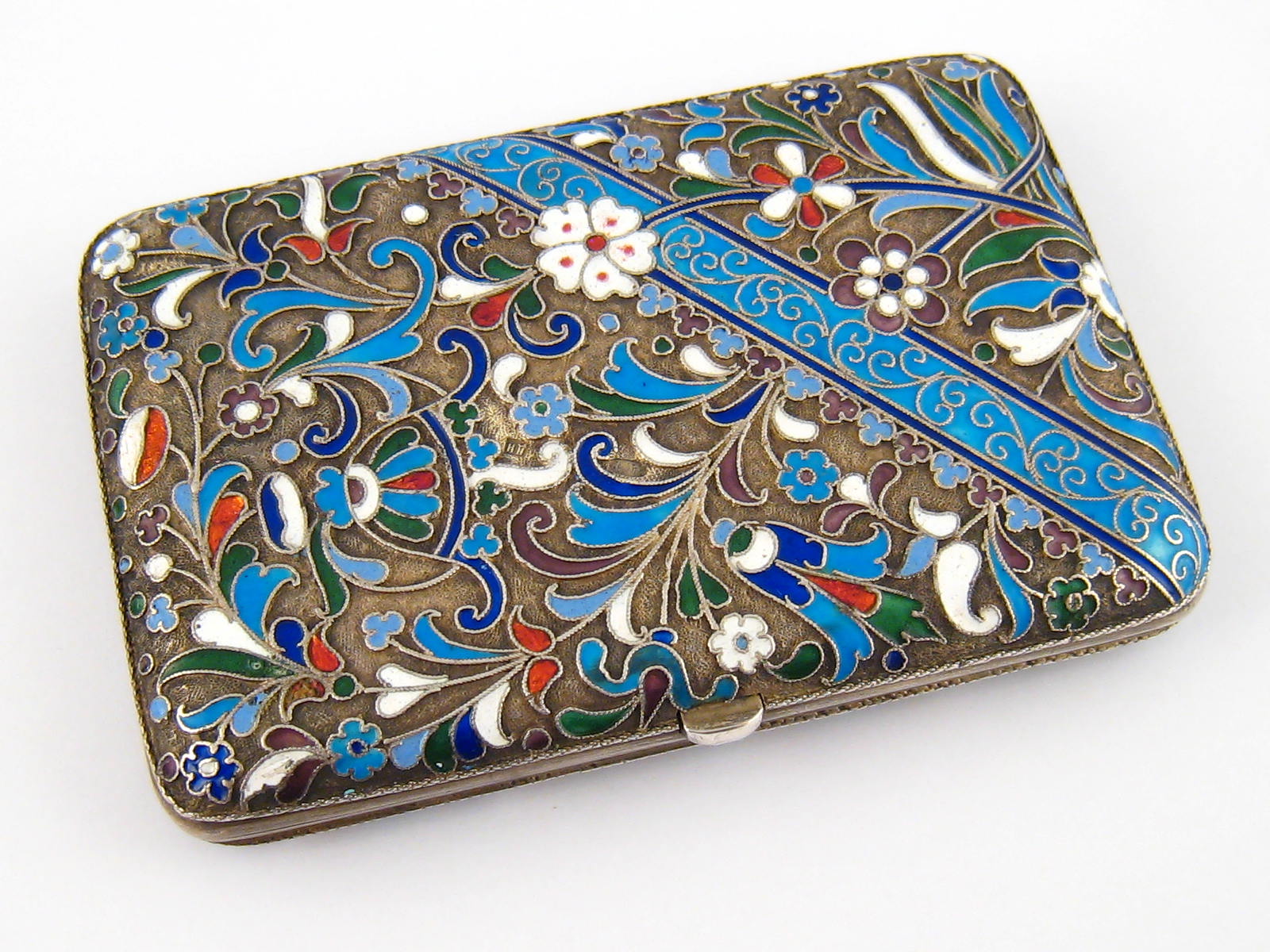 A fine Russian silver cloisonne enamel cigarette case by Dmitri Nikitin, Moscow 1896-1907. 10x6.5cm.