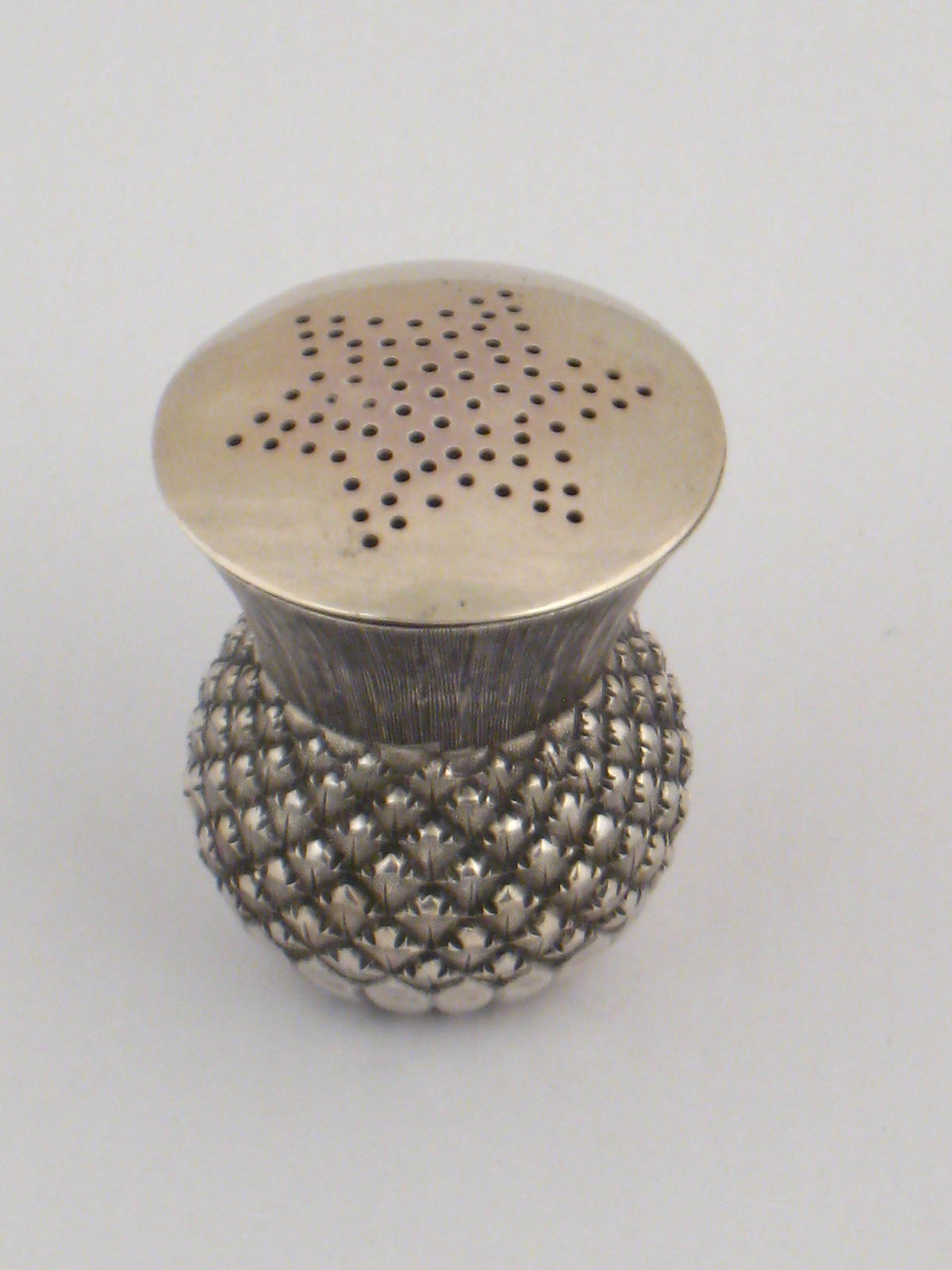 A late Victorian Scottish silver pepper in the form of a thistle head by G.Laing, Edinburgh, 1898.