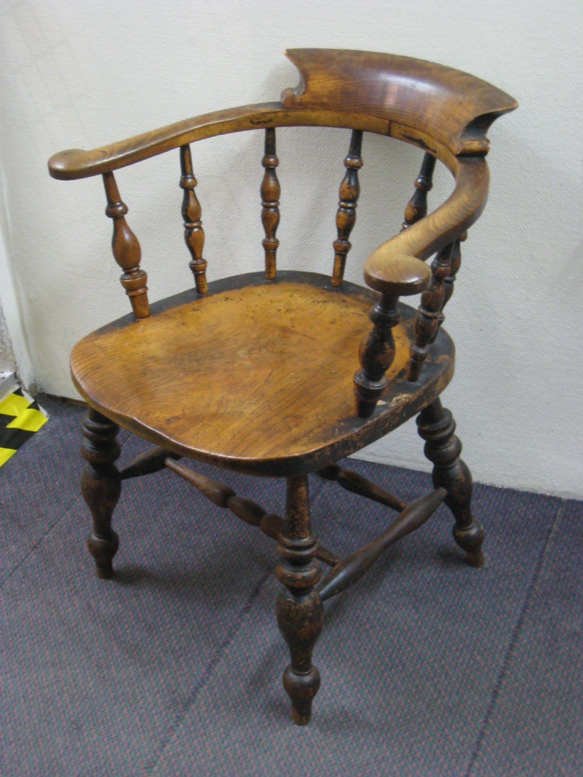 A Victorian smoker's chair of generous proportions, elm seat, good colour and with double
