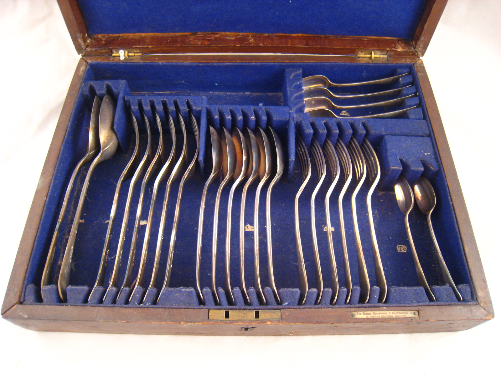 A boxed half canteen of silver plate.