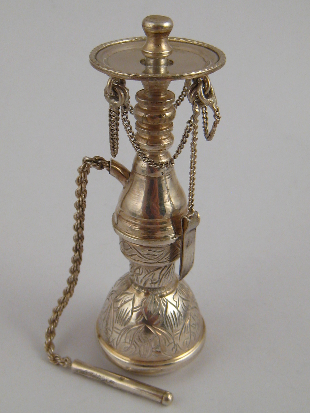 An Egyptian silver miniature model of a shisha, approx. 10cm high, with Egyptian marks.