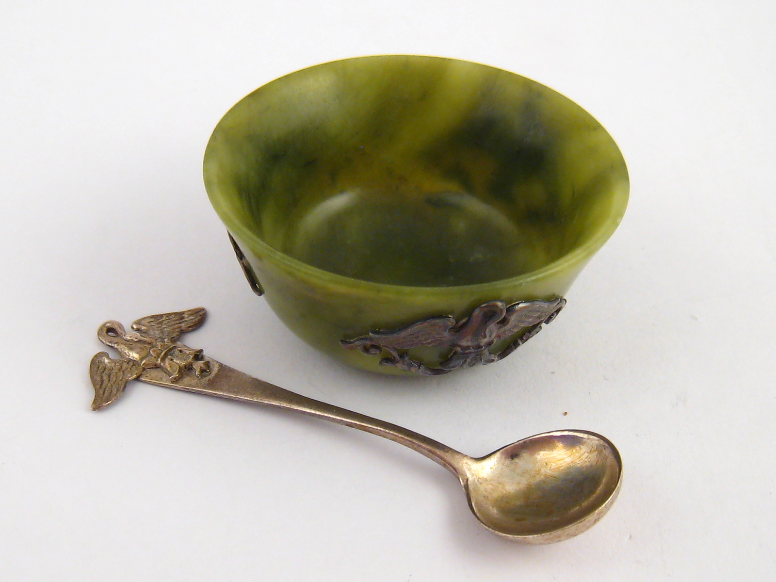 A nephrite salt with silver swan appliques, each marked 88, Moscow 1896-1907, with original spoon,