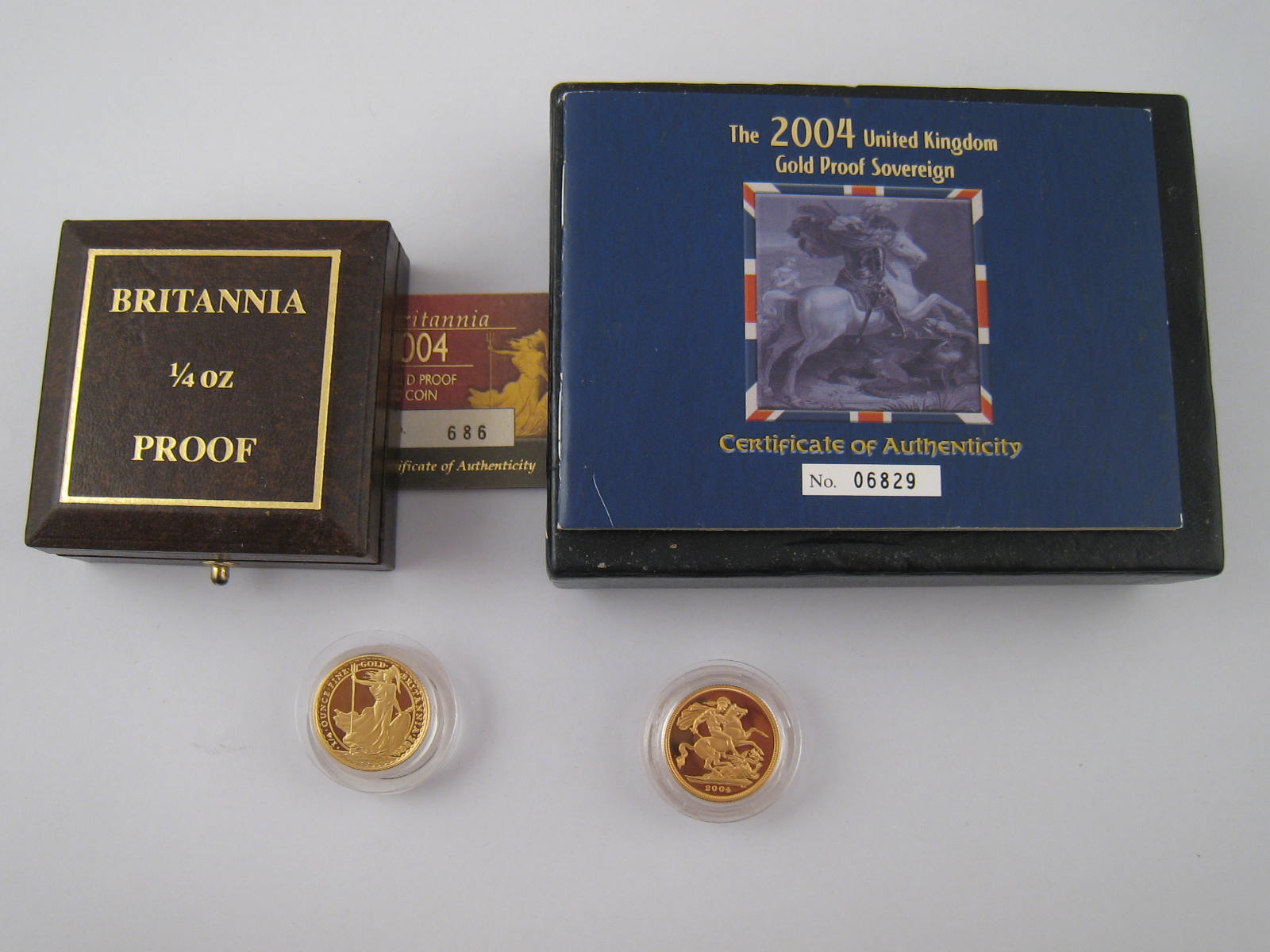 A 2004 gold proof Sovereign and a 1/4 oz gold proof.