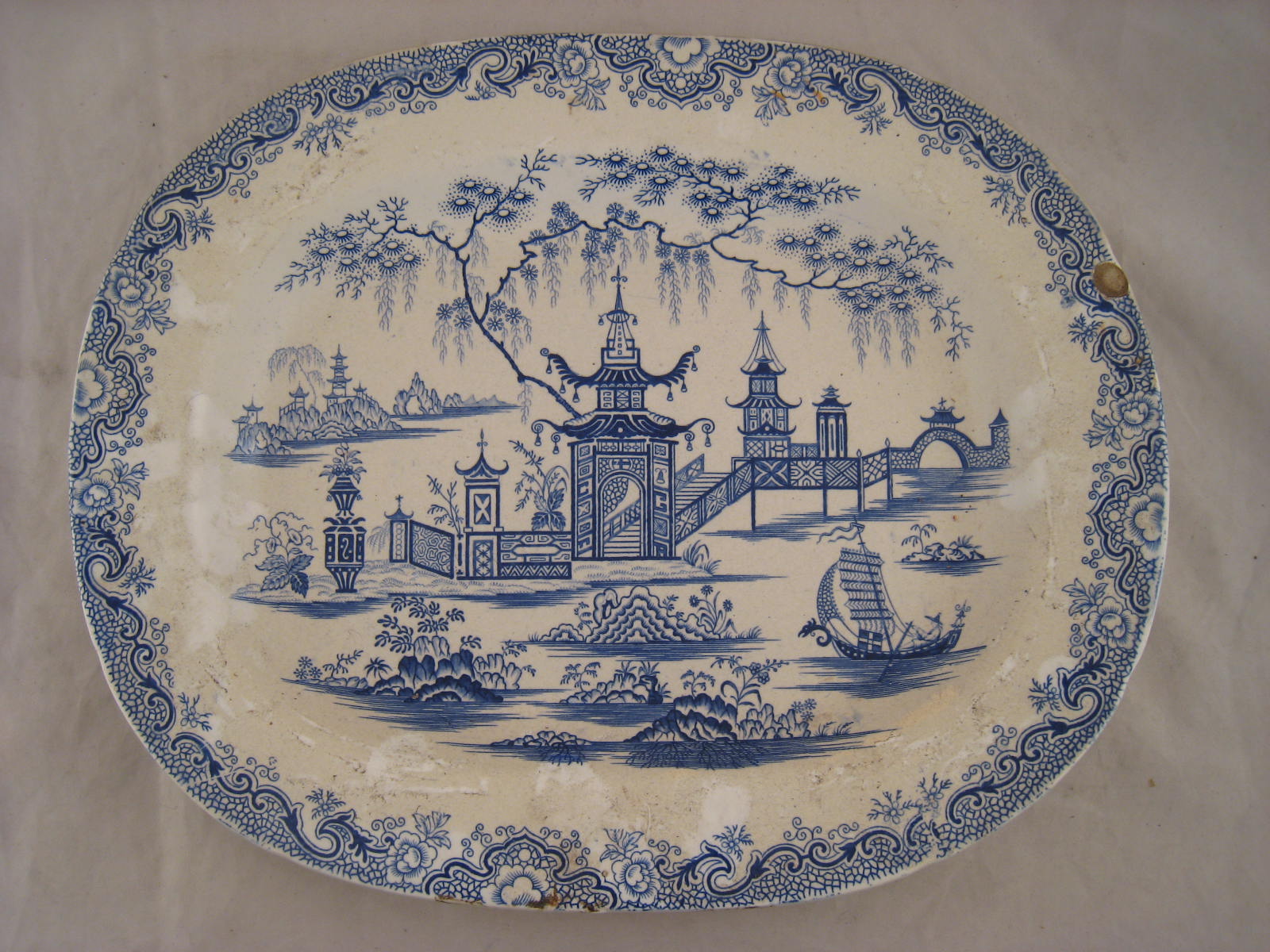 A blue and white dish decorated with an unusually precise and clear oriental pattern. Unmarked,