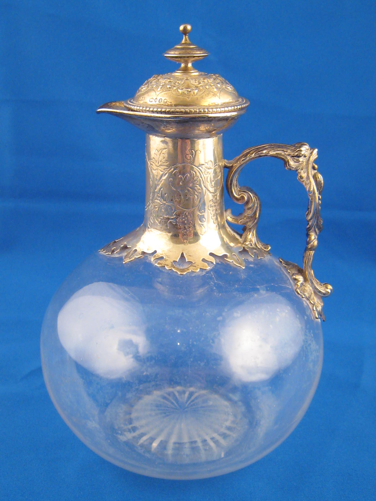 A Victorian silver mounted claret jug,by Robert Hennell, London 1859.