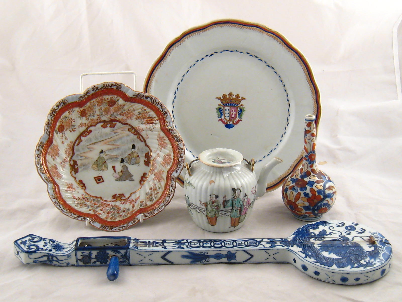 Ceramics. A model two stringed â€œChinese fiddleâ€, a continental ceramic plate with central coat