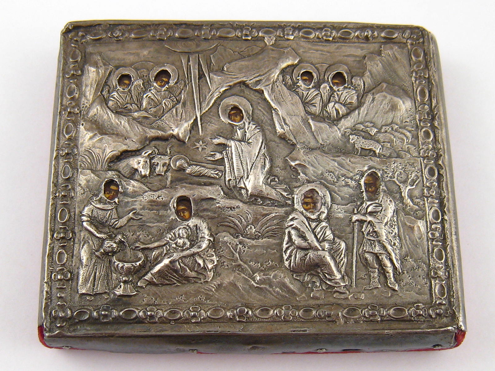 A Russian white metal, marked 84 paperweight with embossed representation of the Nativity. 9x7.5cm.