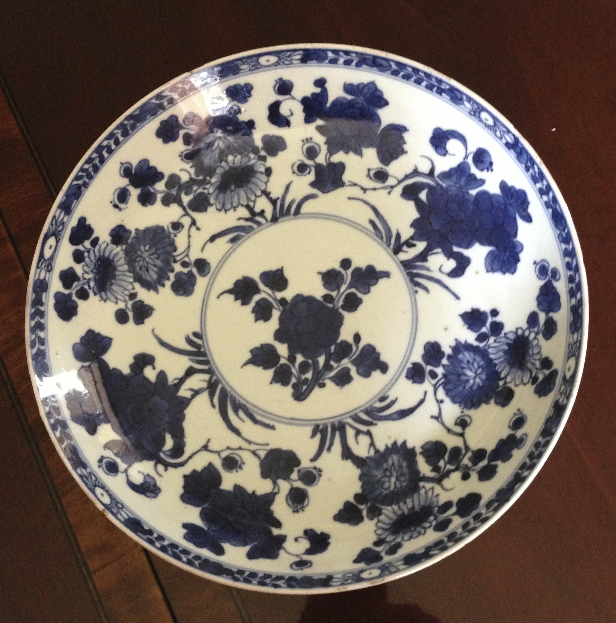 Eighteenth century Chinese blue and white dish with blue square mark, 27cms, minor chips to rim.