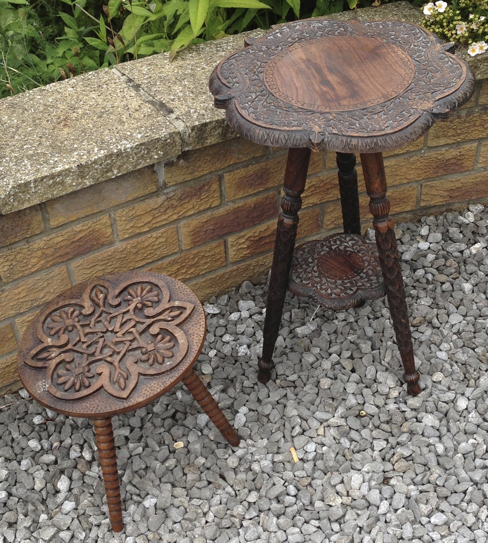 Two ornately carved small tables, one marked L Knox.
