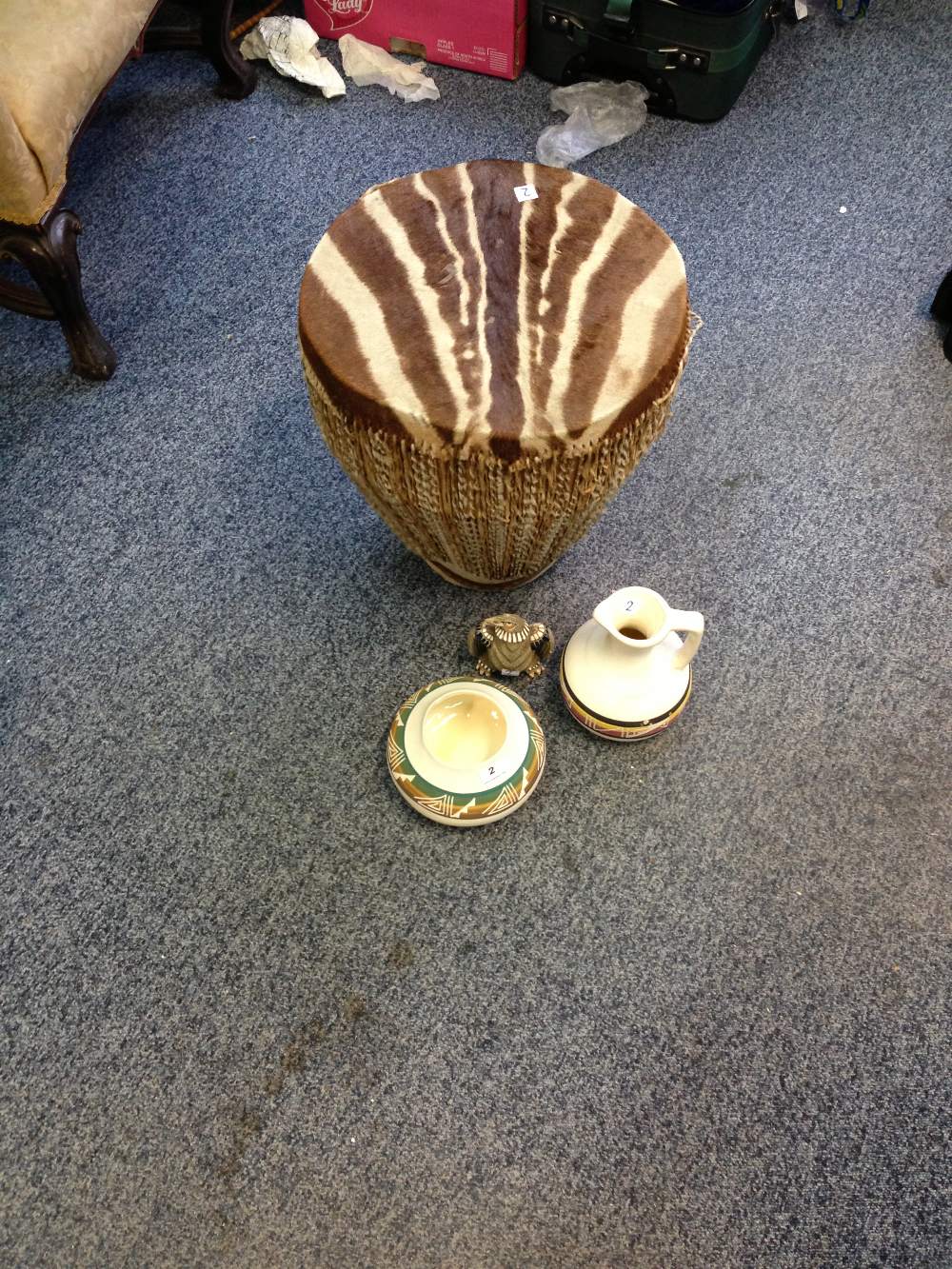 Three items of American Indian pottery and an  African drum.