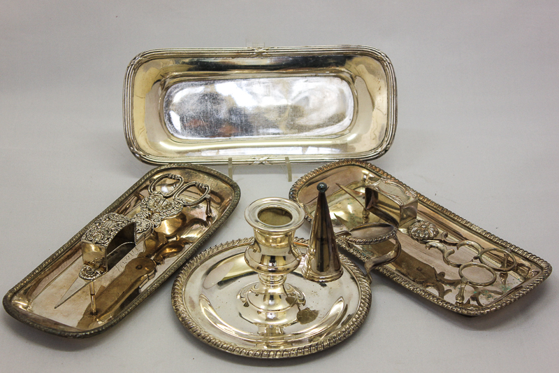 Two 19th century plated `scissor` candle snuffers and three plated snuffer trays; together with a