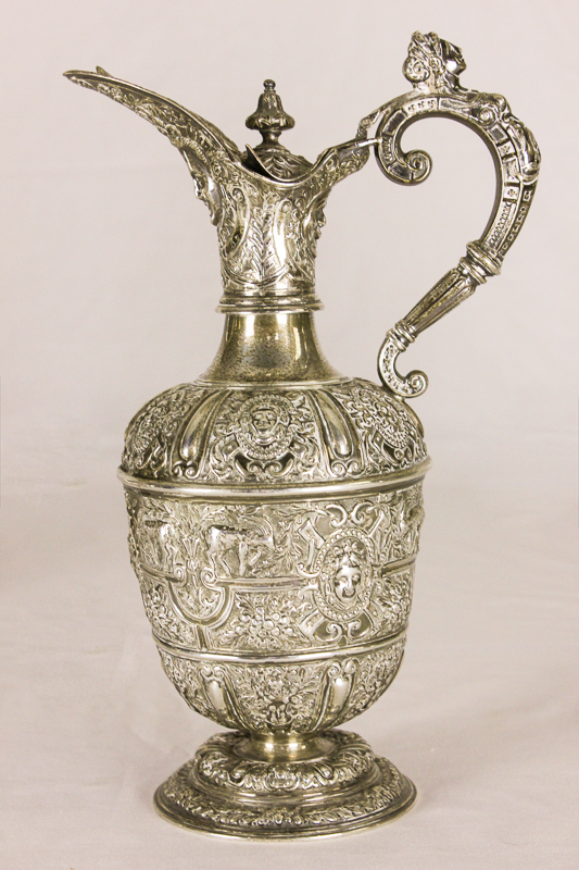 A Victorian Cellini pattern silver ewer, maker Mappin & Webb, London 1898 with mask spout and