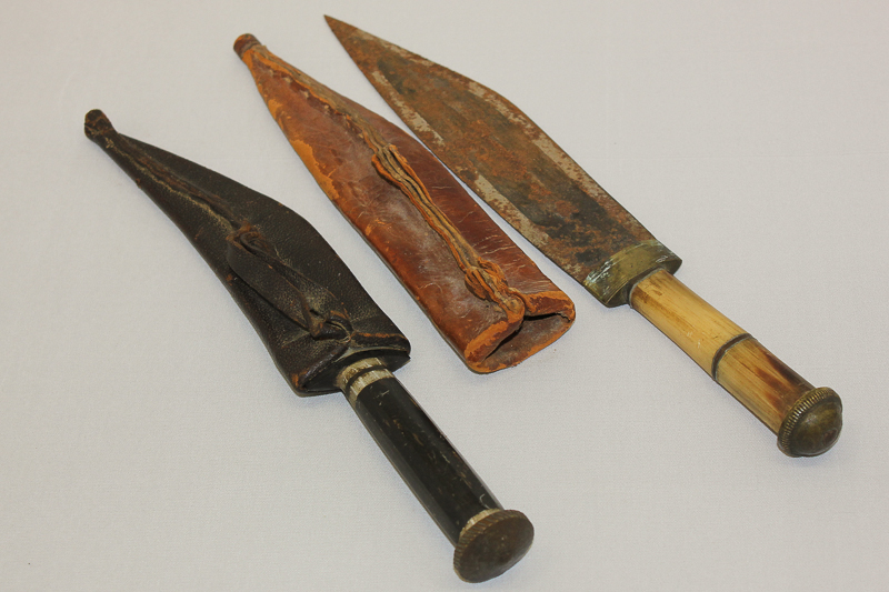 An Eastern horn handled dagger in sheath and another small dagger