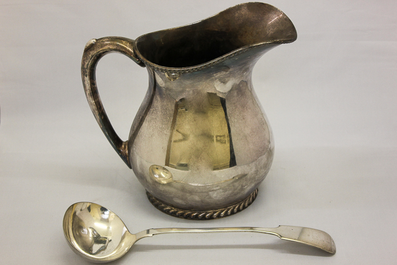 A heavy plated jug with anchor and USN crest, stamped on base R Wallace; together with a plated soup