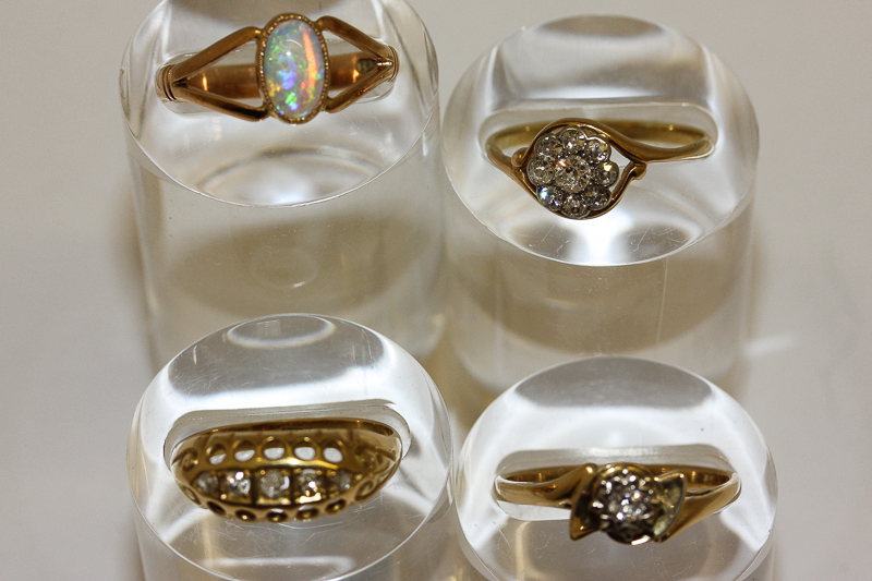 An 18ct gold and cluster diamond set ring; an 18ct gold and single diamond set ring; an 18ct gold