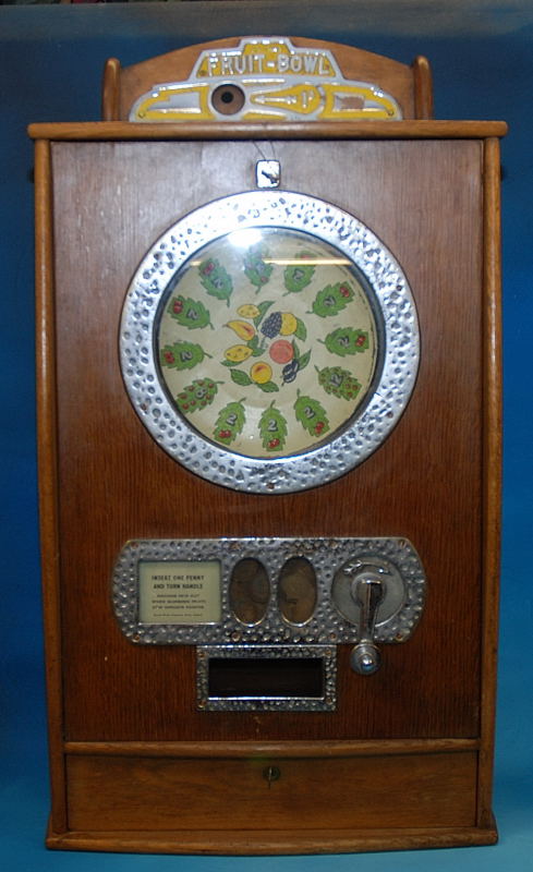 "FRUIT -BOWL" SLOT MACHINE CIRCA - 1960 BY BRYAN, OAK CASE, 84CM HIGH