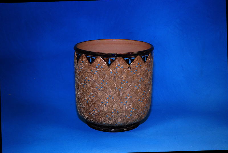 A DOULTON STONEWARE JARDINIERE INCISED DECORATION AND TURQUOISE POLKA DOTS, HEIGHT 18CM AF