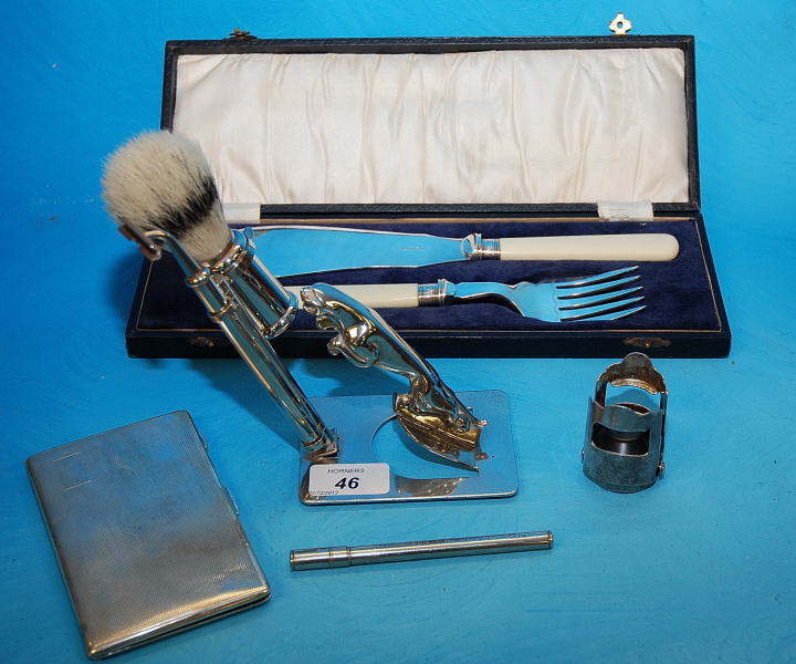 JAGUAR TYPE CHROME SHAVING SET, PLATED CIGARETTE BOX, THERMOMETER, BOTTLE COVER AND CASED FISH