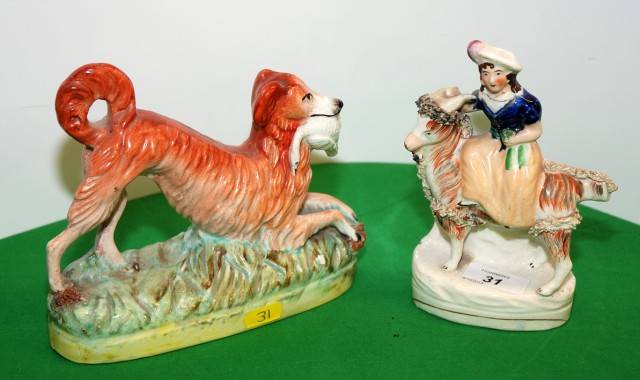 A STAFFORDSHIRE FIGURE OF A GIRL RIDING A GOAT AND A FIGURE OF A HOUND HOLDING A BIRD, 17 CM HIGH