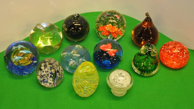 TWELVE GLASS PAPER WEIGHTS, 4 SHAPED AS FRUIT, 2 BUTTERFLIES, ONE WITH DOLPHINS, 1 MUSHROOM AND 4