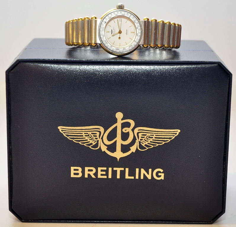 BREITLING ELLESSE GENEVE LADIES SPORTS WATCH, BI-METAL WITH COMPASS HEADING ON WHITE FACE WITH