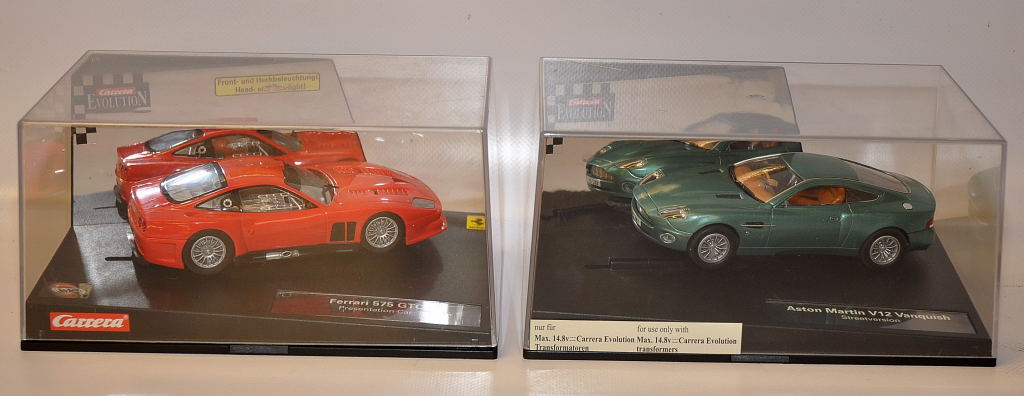 TWO BOXED CARRERA EVOLUTION SCALEXTRIX TYPE CARS - ASTON MARTIN V12 VANQUISH  STREET VERSION AND