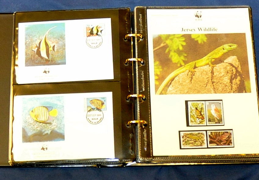 COLLECTION OF WWF STAMPS AND COVERS IN FOUR ALBUMS (100`S)