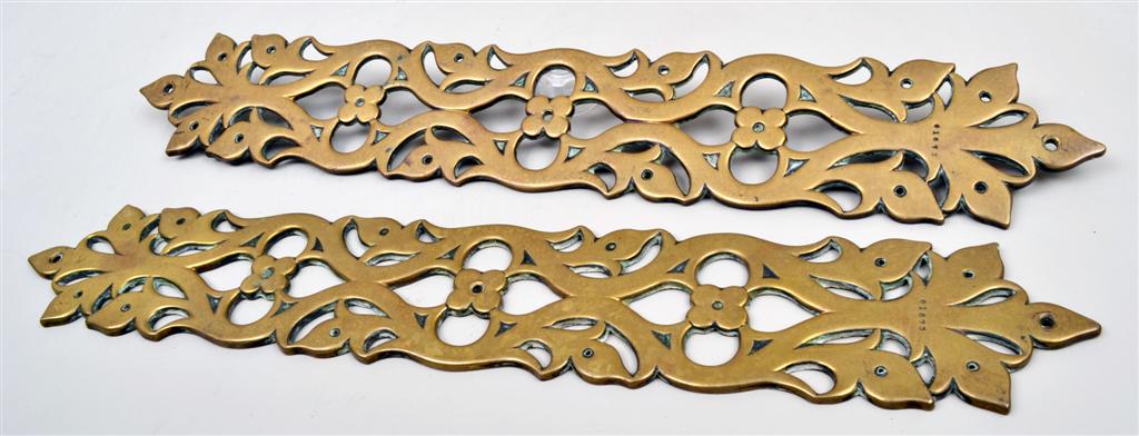 A pair of Victorian brass Gothic Revival door finger plates by John Hardman & Co, probably after a