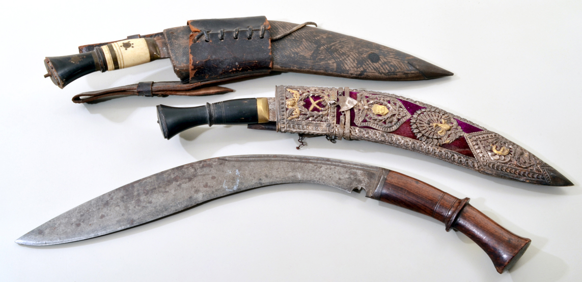 A late 19th century Nepalese Kukri/fighting knife, with rosewood handle, 47cm (18 1/2in) long, no