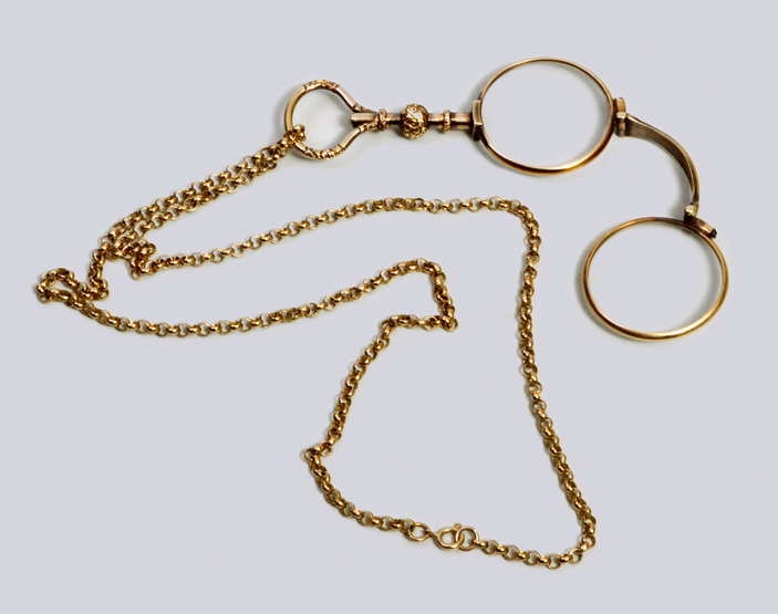 A pair of Victorian lorgnettes, with foliate engraved handle and an associated later 9ct gold open