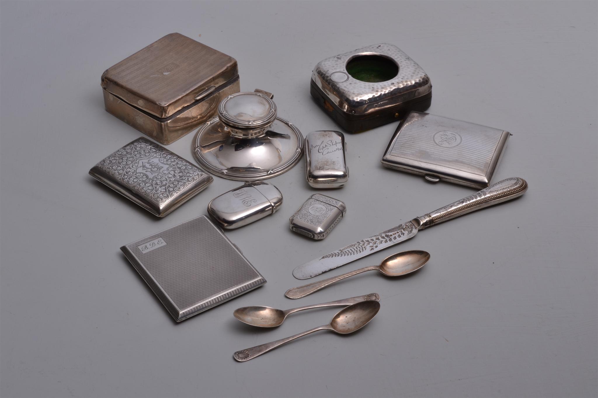 A small collection of silver vesta cases and cigarette cases, capstan inkwell, tooth pick box and