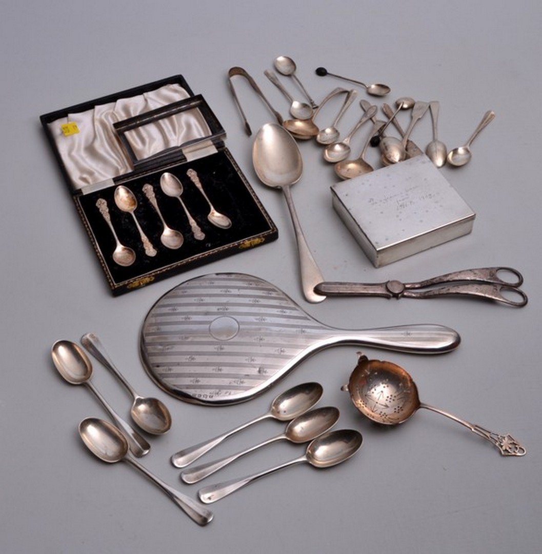 A collection of silver items, to include a hunting saddle sandwich box, spoons, etc