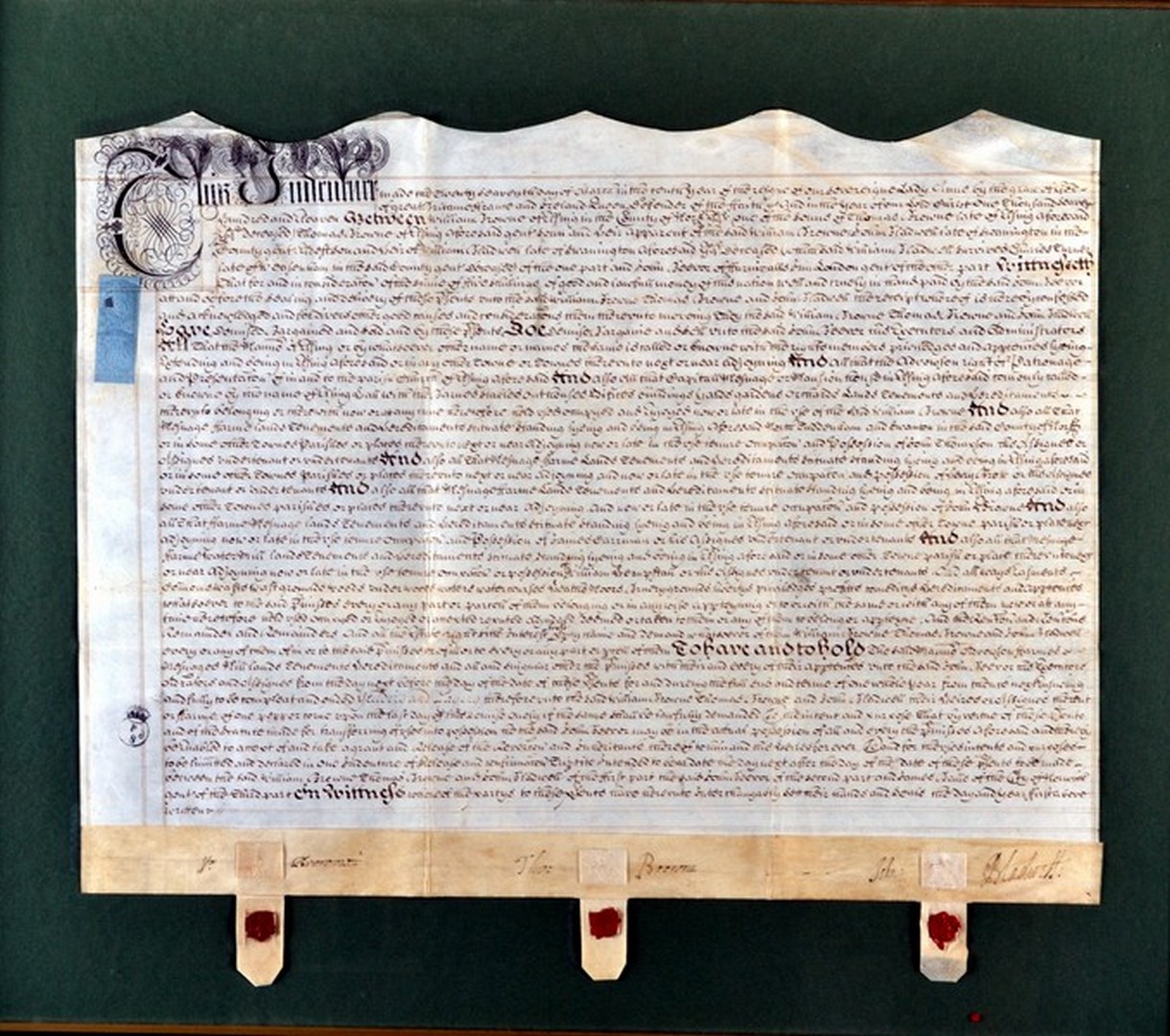 A framed Queen Anne indenture, dated 1711, between William Browne, Thomas Browne and John