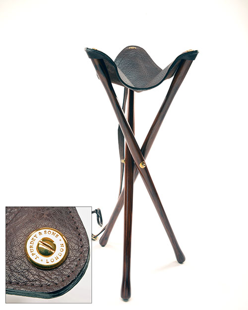 JAMES PURDEY & SONS A FINE NEW AND UNUSED LIGHTWEIGHT WOOD AND LEATHER TRIPOD SEAT with leather