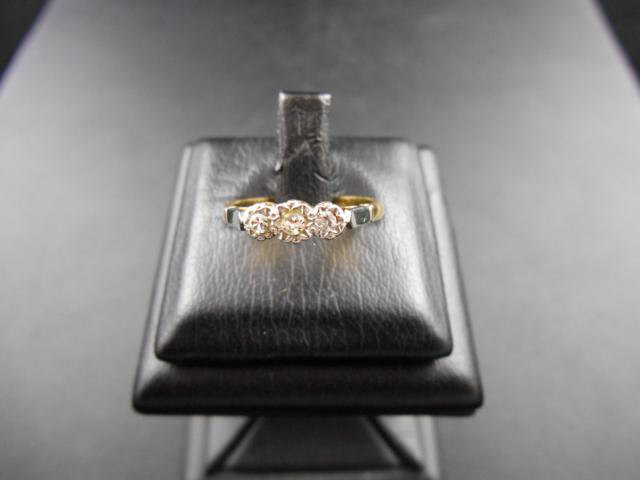 An 18ct gold ring set with three diamonds, size K - approx gross weight 2.6g