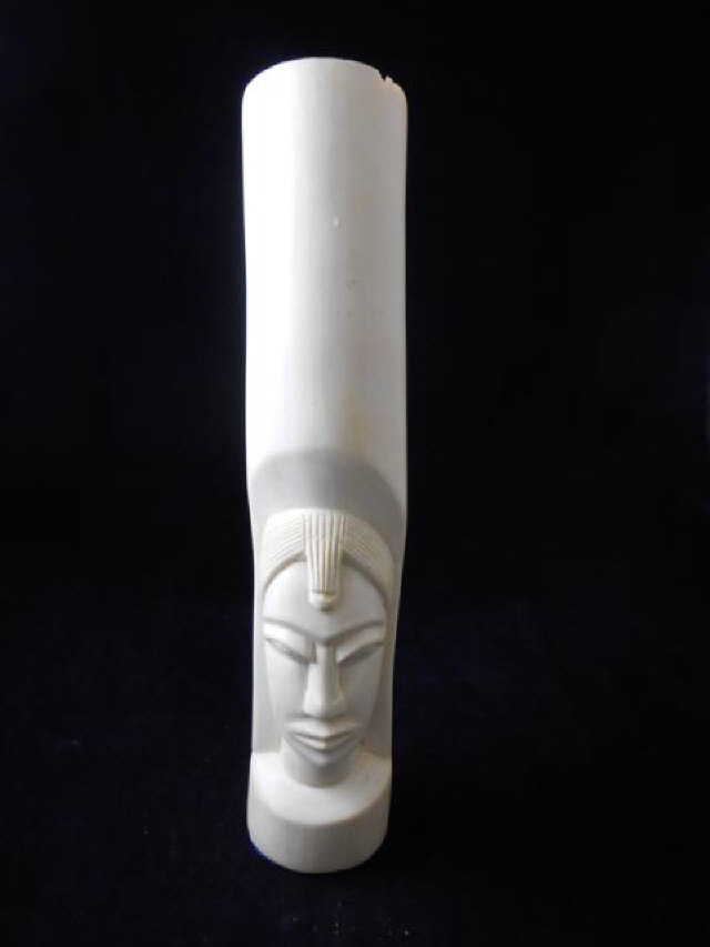 An African carved ivory figure depicting head with head dress  - H39cm