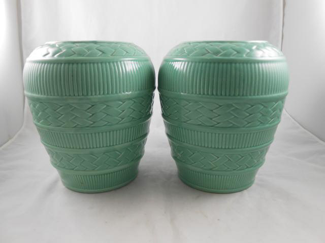 A pair of 1930`s green glazed vases with moulded `basketwork` design - H27cm